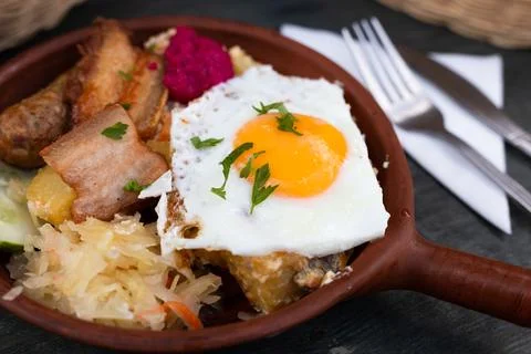 Breakfast dish - scrambled eggs with fried bacon Stock Photos