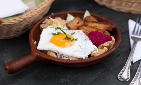 Breakfast dish - scrambled eggs with fried bacon Stock Photos