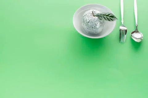 Breakfast dish set plate fork spoon apple in foil. Stock Photos