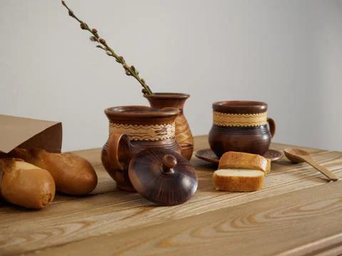 Breakfast in earthenware on a wooden table side view. French traditional Stock Photos