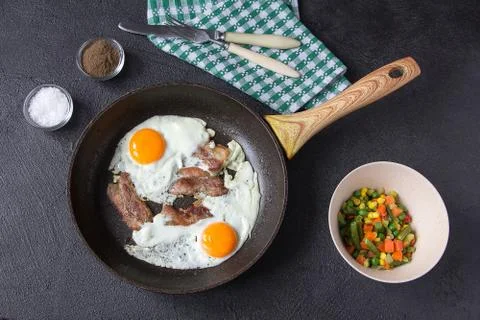 Breakfast egg bacon vegetables lunch ingredients Stock Photos