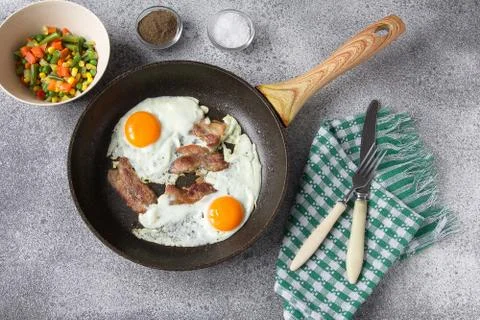 Breakfast egg bacon vegetables lunch ingredients Stock Photos
