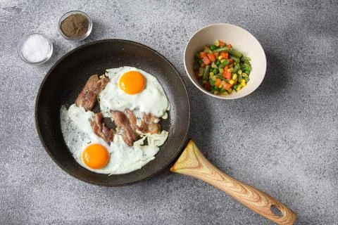 Breakfast egg bacon vegetables lunch ingredients Stock Photos