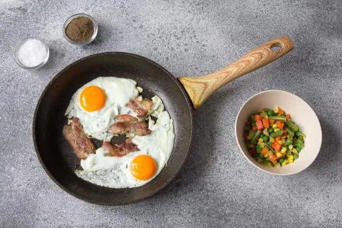 Breakfast egg bacon vegetables lunch ingredients Stock Photos