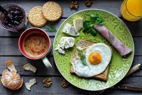 Breakfast with an egg on a toast Stock Photos