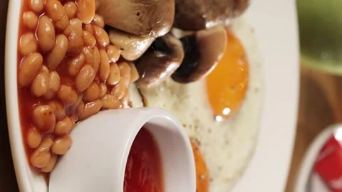 Breakfast of eggs bacon beans and sausages Stock Footage 263730086