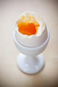 Breakfast eggs in egg cup Foto stock