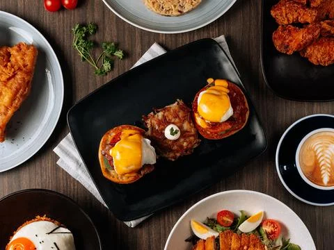 A breakfast fast food table Pan Fried Wild Cod Fish, Kimchi Fried Rice, Wing  Stock Photos
