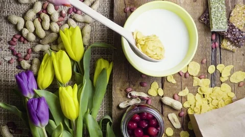 Breakfast flakes with tulips, rustic style Stock Footage 73255992