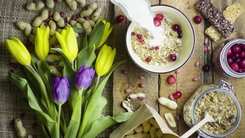 Breakfast with flowers, rustic style, top view, slow motion Stock Footage 73255943