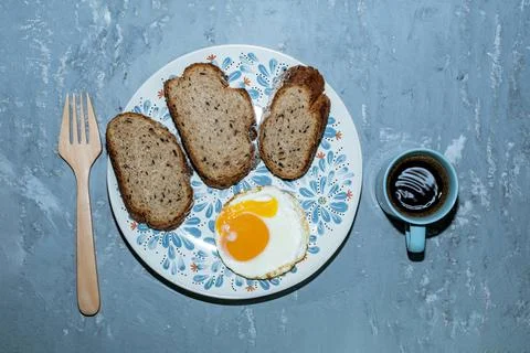 Breakfast food fried egg bread slice in plate has espresso coffee isolated on Stock Photos