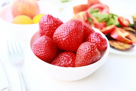 Breakfast - fresh strawberries on table Stock Photos