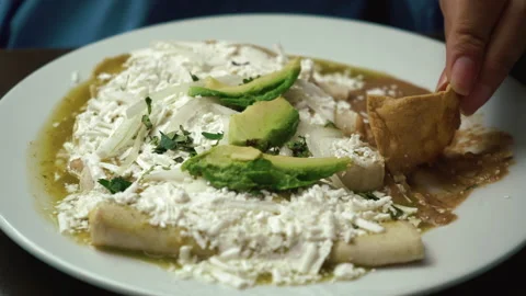 Breakfast fried egg, avocado, cheese and chips on the table. food footage Stock Footage 168907825