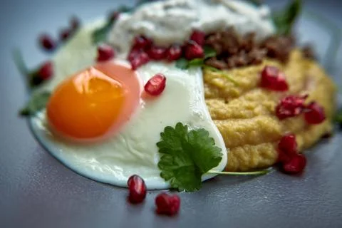 Breakfast - fried egg, beans, tomatoes, mushrooms, garnet.  Stock Photos