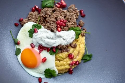 Breakfast - fried egg, beans, tomatoes, mushrooms, garnet.  Stock Photos