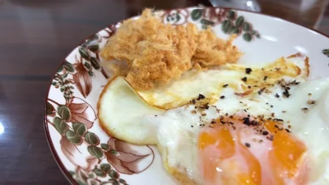 Breakfast fried egg with dry meat on plate Vietnam lunch rice pilaf with roasted Stock Footage 280112212