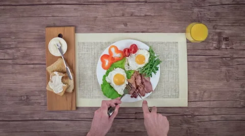 Breakfast with fried eggs and bacon. Stock Footage 63110931