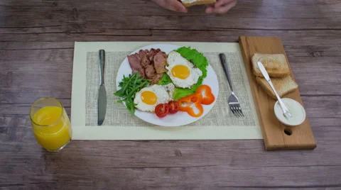 Breakfast with fried eggs and bacon. Stock Footage 63111427