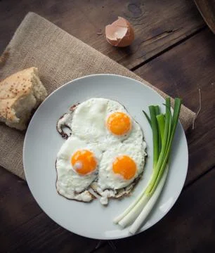 Breakfast with fried eggs and spring onion Stock Photos