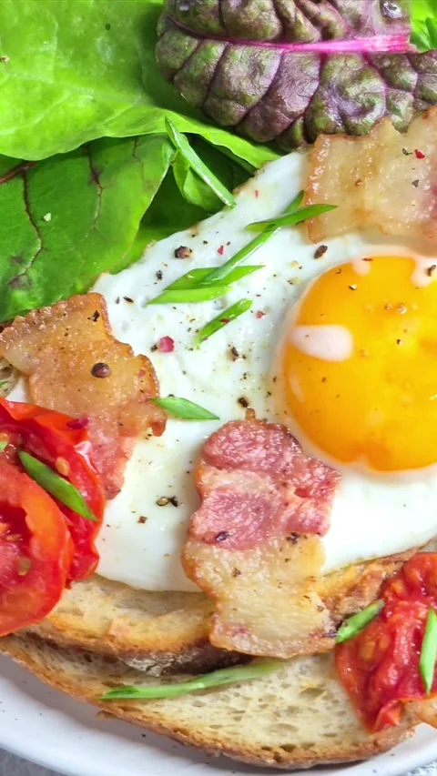 Breakfast.   fried eggs with bacon Stock Footage 304977685