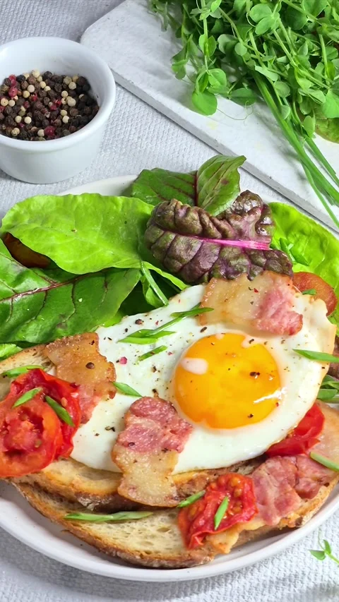 Breakfast.   fried eggs with bacon Stock Footage 304977795