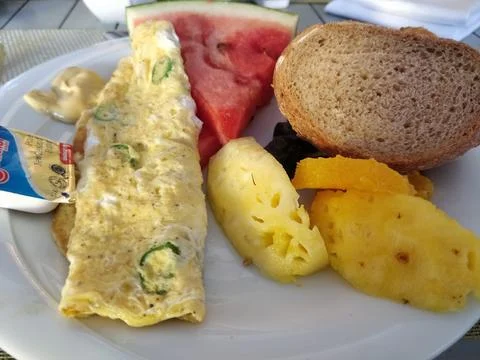 Breakfast Fried omelet with Bread,Fruits slice like Pineapple and Watermelon 스톡 사진