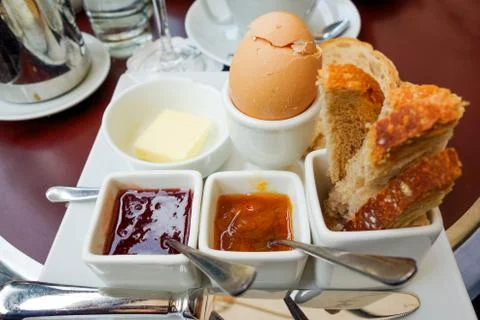 Breakfast with fruit jam.and egg on table Stock Photos