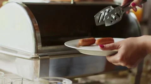 Breakfast at the hotel. Sausages on buffet Video stock 56030662