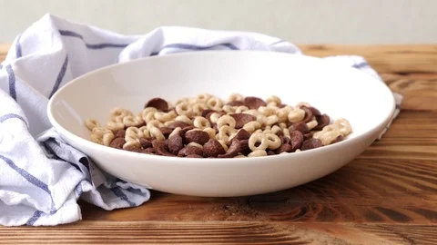 Breakfast included corn flakes, milk and raspberies. Video stock 77615391