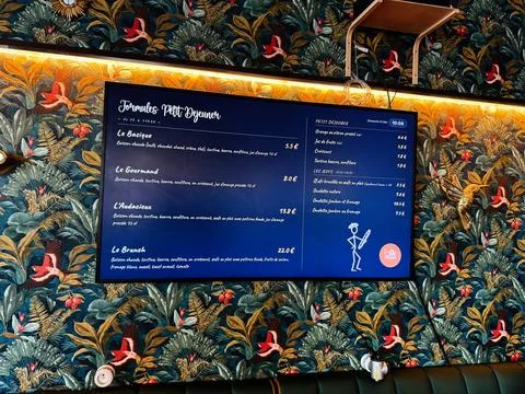 Breakfast Le Saint Placide menu board in a Paris, France caf with decorativ.. Stock Photos