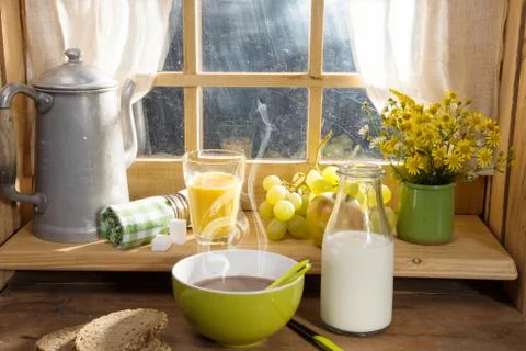 Breakfast with milk, bread, fruit, orange juice Stock Photos