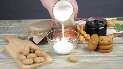 Breakfast. Milk, cornflakes, berries and yogurt Video stock 169998970