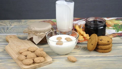 Breakfast. Milk, cornflakes, berries and yogurt Video stock 169999190
