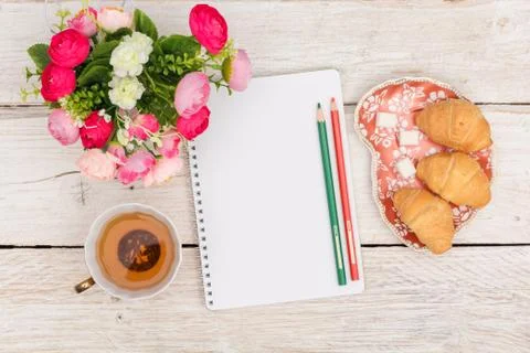 Breakfast, notes and flowers Stock Photos