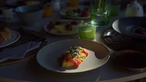 Breakfast omelet with vegetables stands on the table Stock Footage 273380719