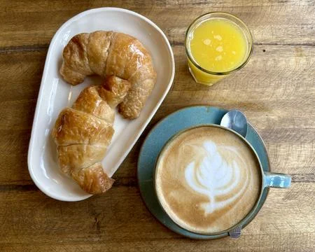Breakfast or brunch table scene on a wooden background. Above view. Stock Photos