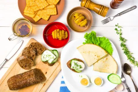 Breakfast or lunch for two on white table. Top view Stock Photos