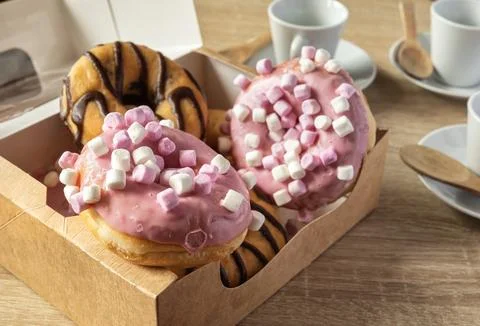 Breakfast or snack with donuts and coffee Stock Photos