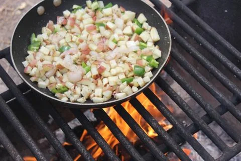 Breakfast over camp fire Stock Photos