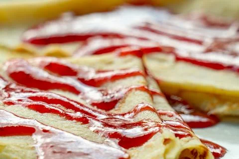 Breakfast with pancakes topped with raspberry jam Stock Photos