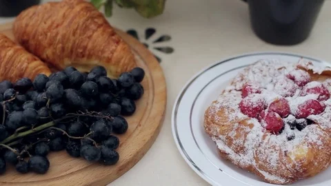 Breakfast Pastries With Tea and Grapes on the Balcony 스톡 동영상 71508561