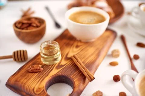 Breakfast pattern, coffee, honey, cinnamon sticks, nuts, sugar. Good morning  Stock Photos