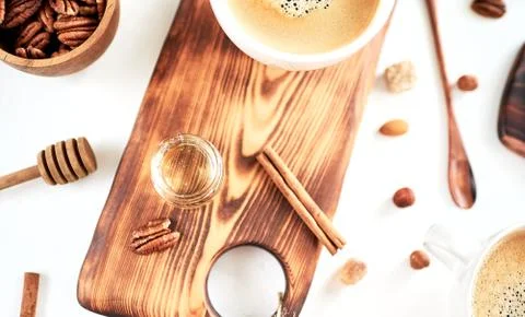 Breakfast pattern, coffee, honey, cinnamon sticks, nuts, sugar. Good morning  Stock Photos