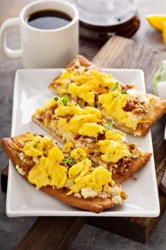 Breakfast pizza, flatbread with scrambled eggs Stock Photos