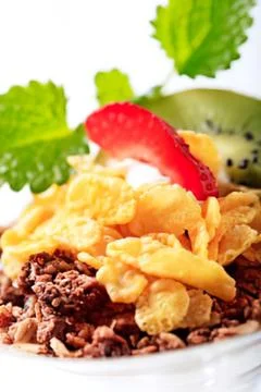 Breakfast plate with eggs, bacon, and kiwi Stock Photos