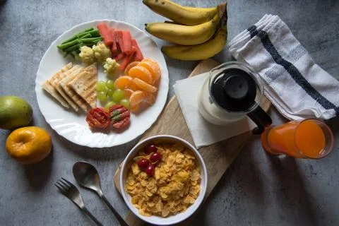 Breakfast platter arranged with rich protein content of cornflakes, fruits Stock Photos