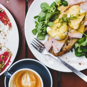 Breakfast with poached eggs on bread and coffee, square crop Stock Photos