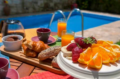 Breakfast at pool side Stock Photos