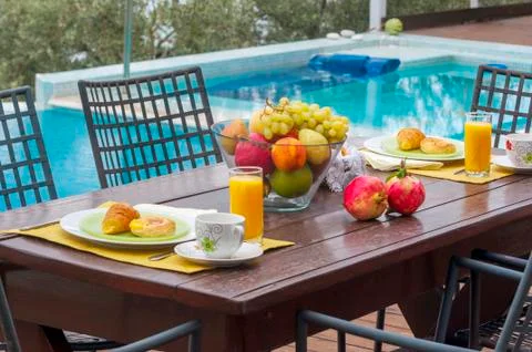 Breakfast in poolside Stock Photos