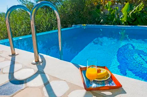 Breakfast in poolside Stock Photos